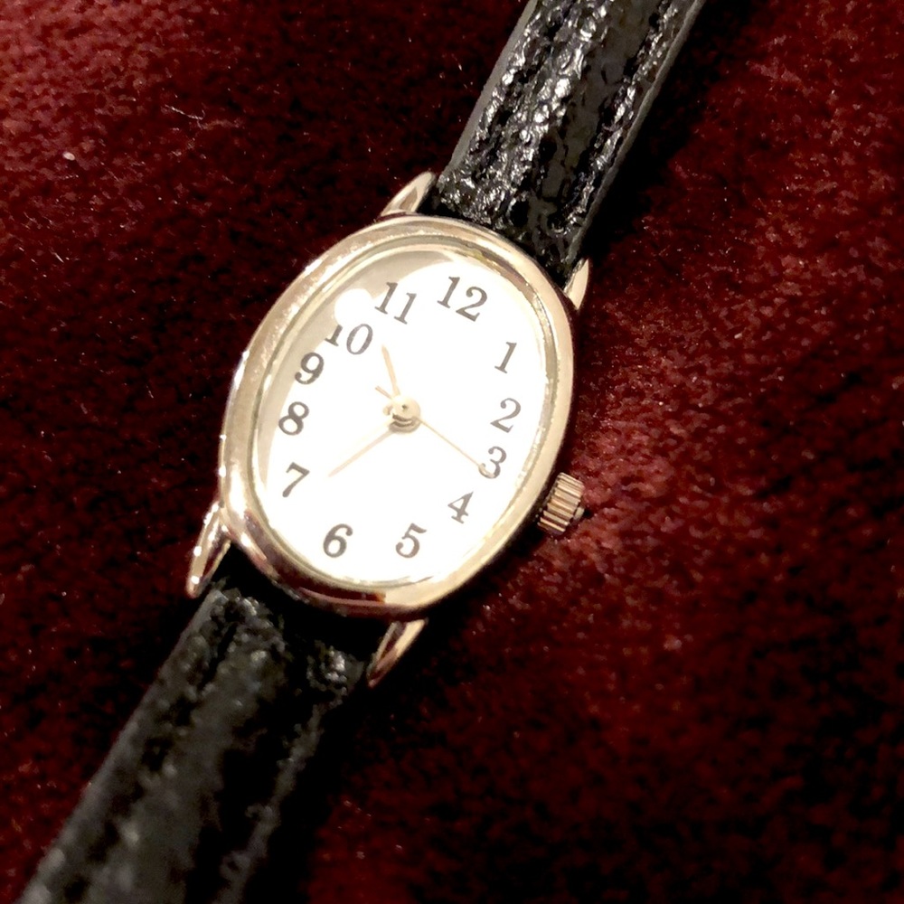 Thin black leather watch w/ silver detail